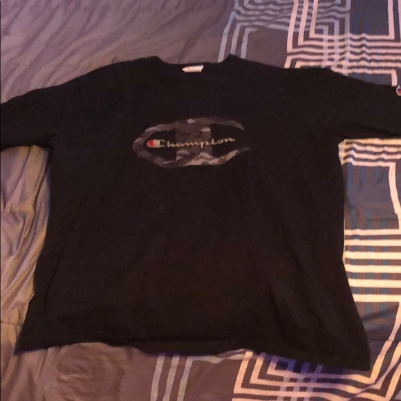 gold and black champion shirt